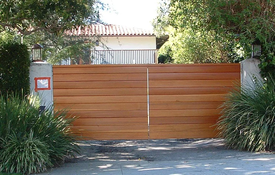 Driveway gate on a sloped entrance